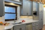 Gray cabinets with New Mexico accents